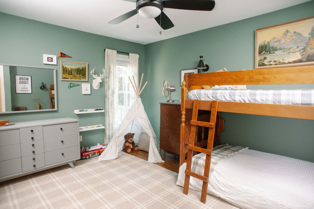 Boy's room with Sherwin Williams Privilege Green Walls, Vintage Artwork, Vintage furniture, bunk bed