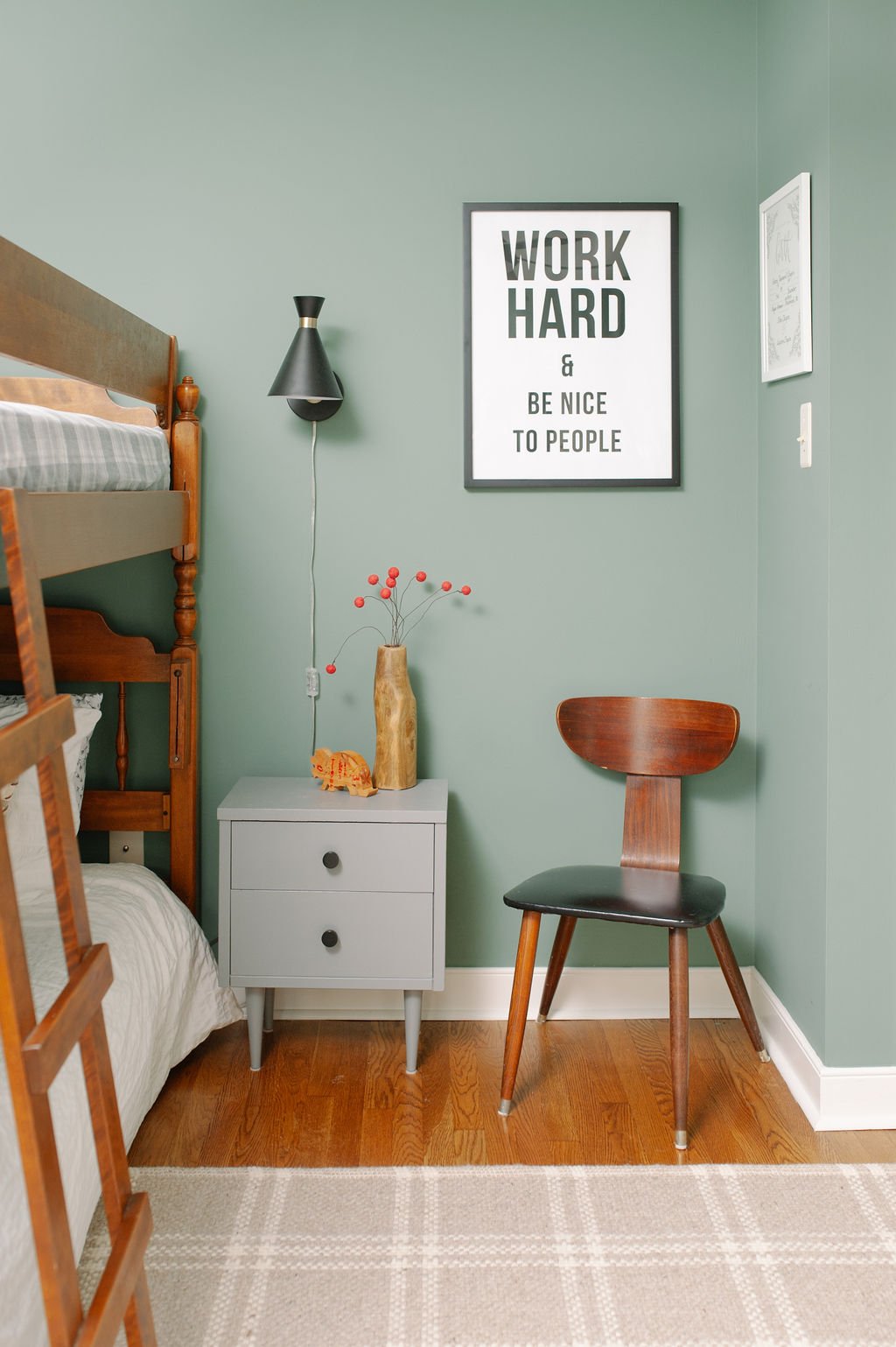 Little Boy's room in Sherwin Williams Privilege Green with Bunk Bed and Midcentury nightstand with Poster that says Work Hard & Be Nice to People